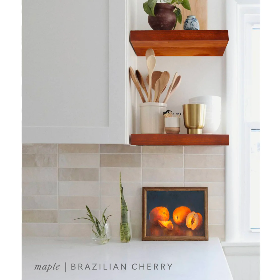 maple floating shelves in a kitchen with the Brazilian cherry finish applied decorated with kitchen utensils, a plant, charcuterie board, and vases