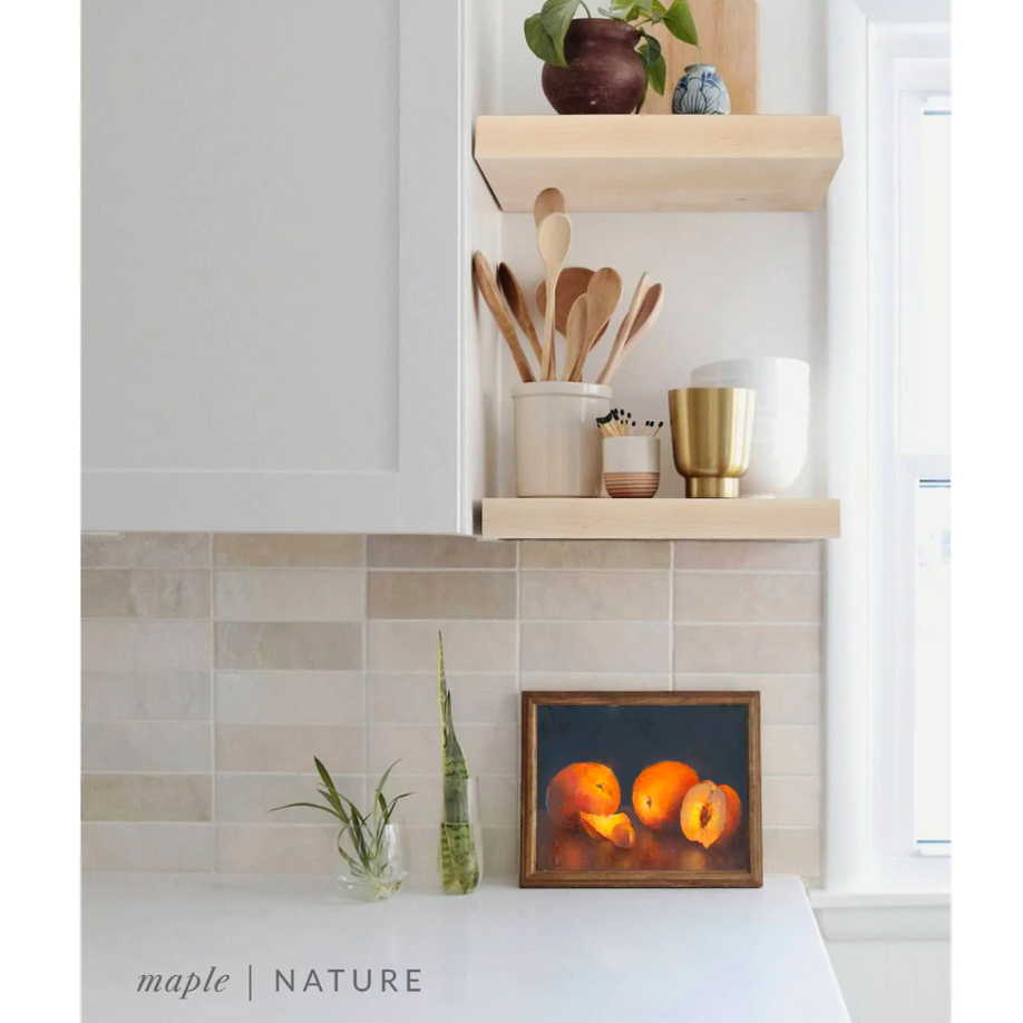 maple floating shelves in a kitchen with the natural finish applied decorated with kitchen utensils, a plant, charcuterie board, and vases