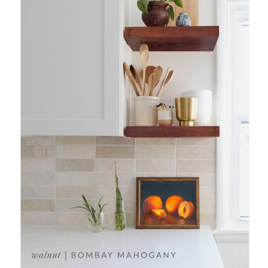 walnut floating shelves in a kitchen with the bombay mahogany finish applied decorated with kitchen utensils, a plant, charcuterie board, and vases