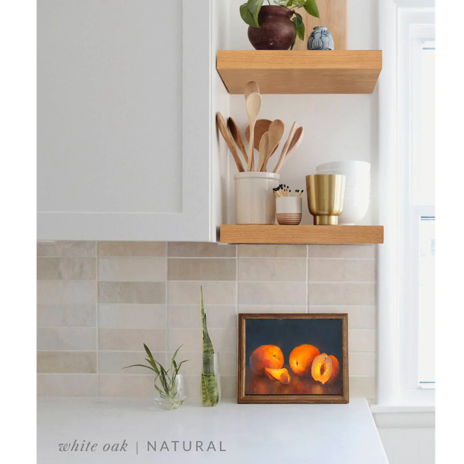 white oak floating shelves in a kitchen with the natural finish applied decorated with kitchen utensils, a plant, charcuterie board, and vases