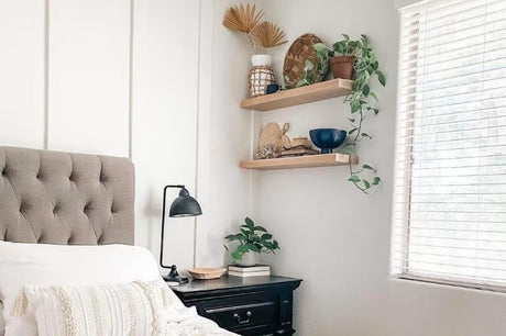 A bedroom with floating shelves