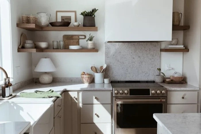 A kitchen with floating wall shelves