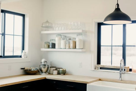 A beautiful bright kitchen with warm floating shelves.