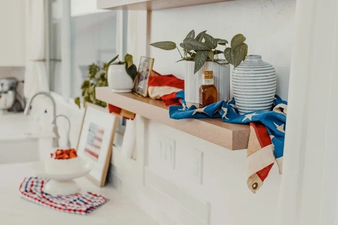 Floating shelves with red, white, and blue decor