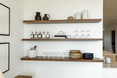 Kitchen items displayed on custom floating shelves