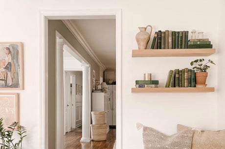 Floating shelves near a doorway