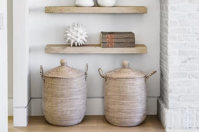 Two baskets underneath two floating shelves