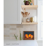 maple floating shelves in a kitchen with the natural finish applied decorated with kitchen utensils, a plant, charcuterie board, and vases